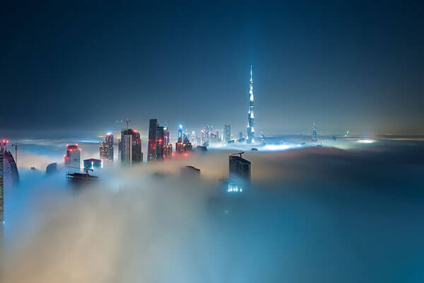 View of Burj Khalifa above the clouds at night
